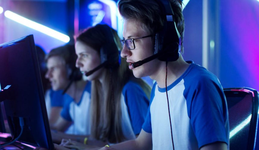 Team of Teenage Gamers Play in Multiplayer PC Video Game on a eS